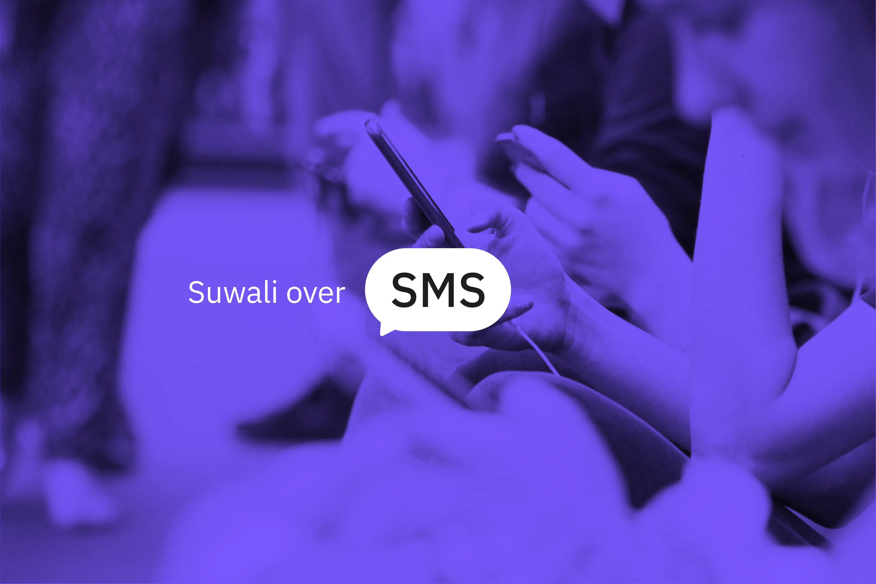 Hands holding smartphones in a violet-toned photo, with a white SMS speech bubble and the words "Suwali over SMS"